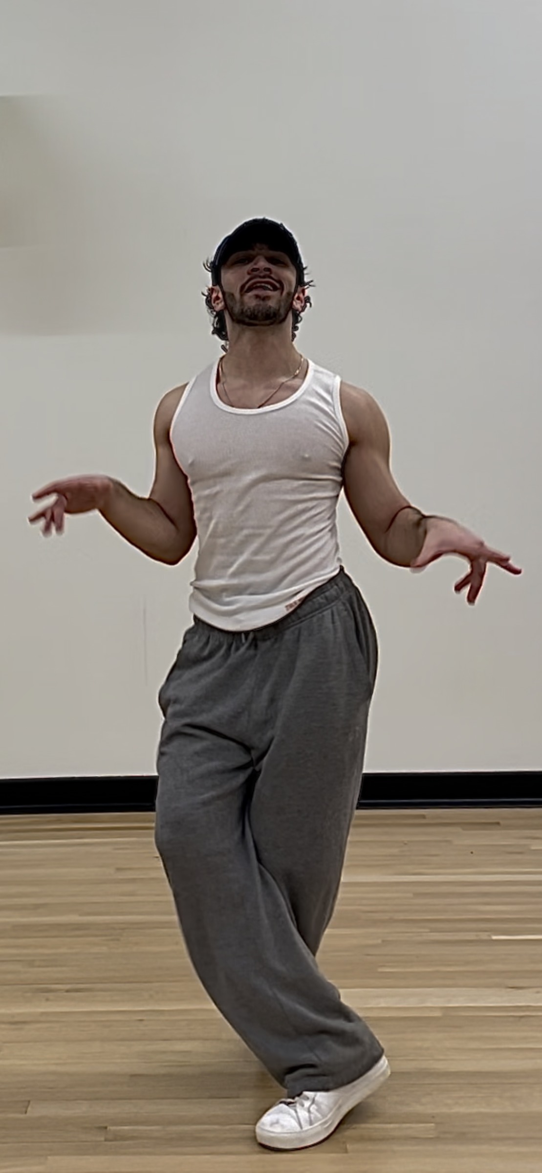 Kiran Behr demonstrating a dance and movement combination in a studio
