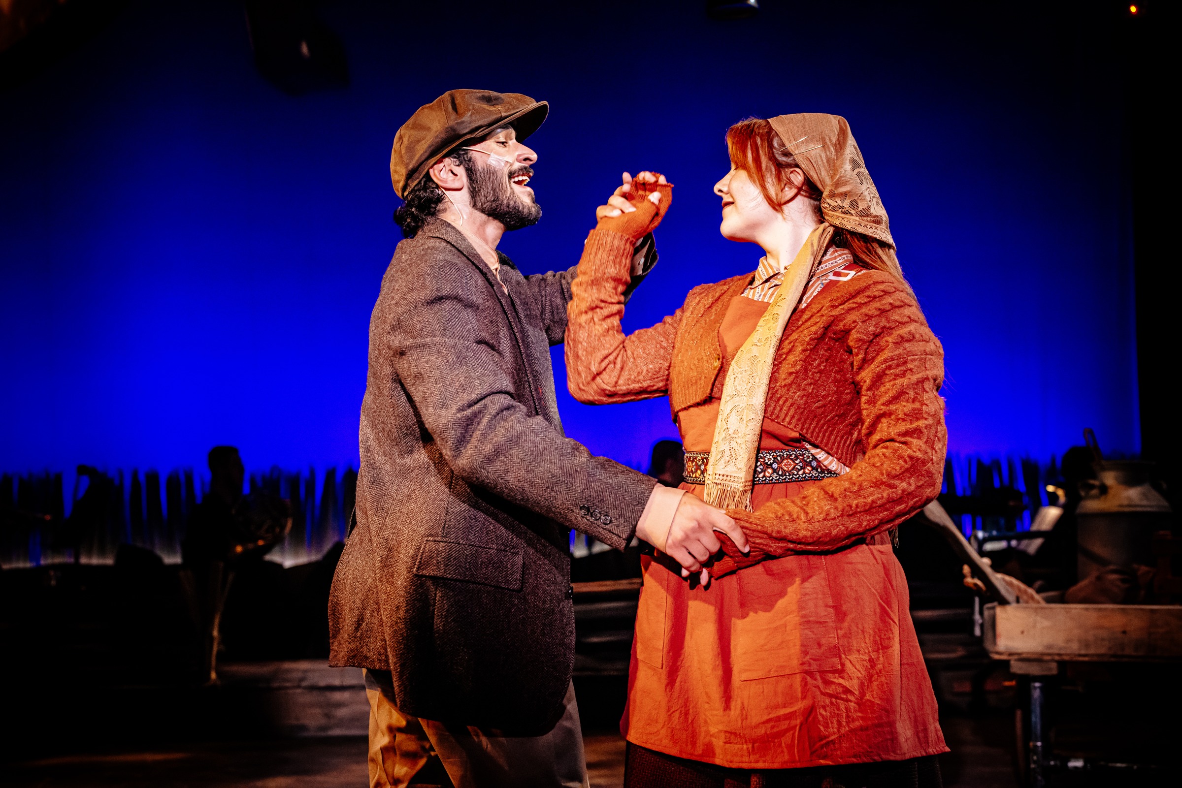 Kiran Behr as Perchik in Fiddler on the Roof, dancing with a fellow performer